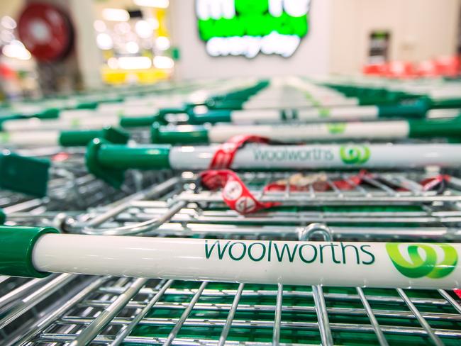 The logo of Woolworths Ltd.'s Woolworths chain of supermarkets is displayed on shopping trolleys in Sydney, Australia, on Tuesday, Aug. 27, 2013. Woolworths Ltd., Australia's largest retailer, is scheduled to report full-year results on Aug. 28. Photographer: Ian Waldie/Bloomberg