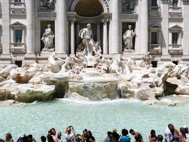 Question 6: Tourists gather by the Trevi Fountain. Picture: Alberto Pizzoli/AFP