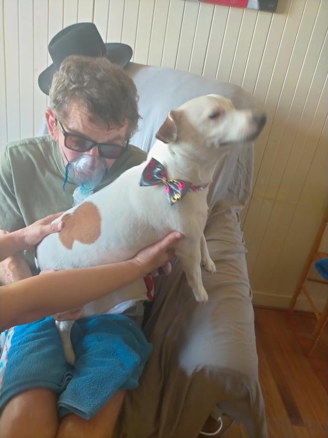 Owen Burdock on the nebuliser with support dog Frank in August, 2021. Picture: Supplied.