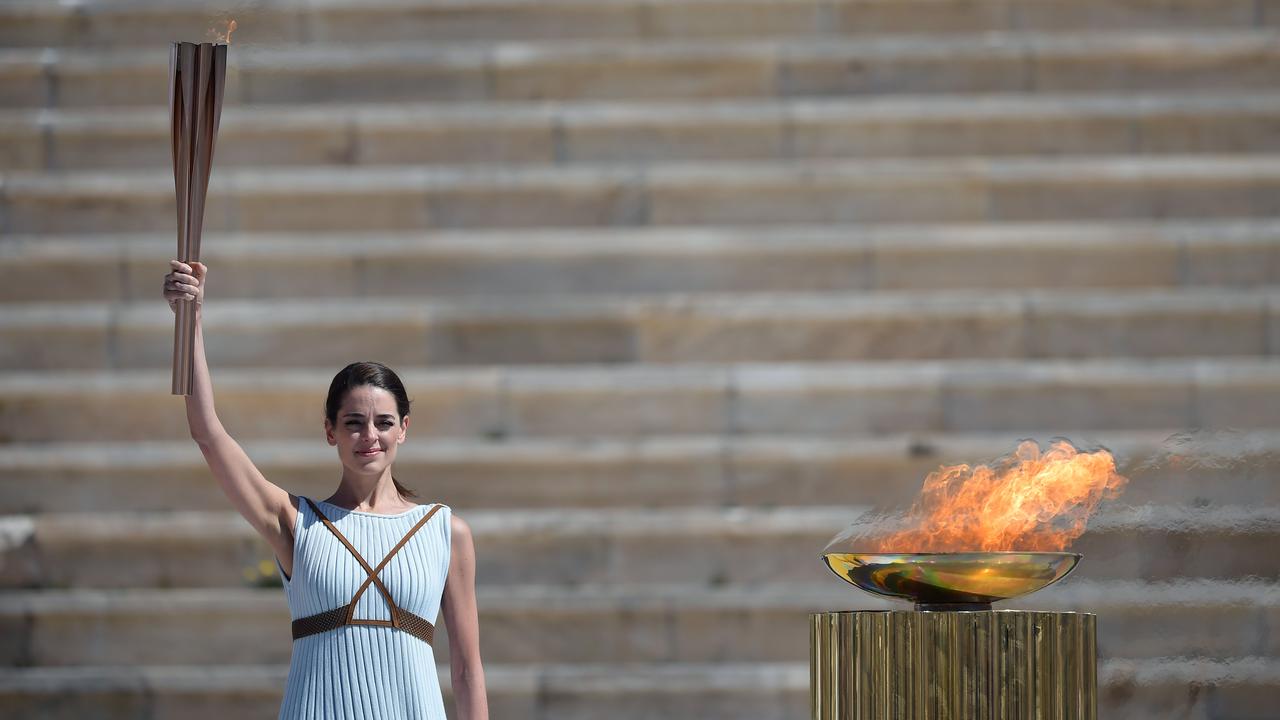 An actor is dressed as an Ancient Greek high priestess for the ceremony to handover the Olympic flame for the Tokyo Olympics. Picture: AFP