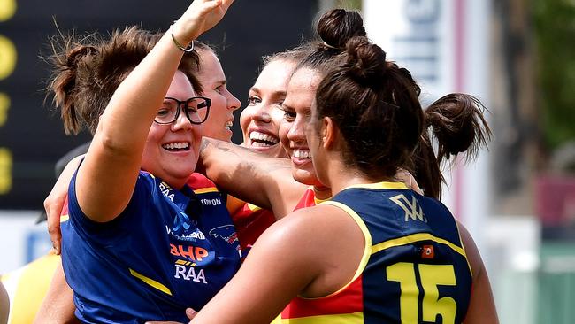 Adelaide coach Bec Goddard celebrates with her players after their first win of the season. Picture: Bianca De Marchi