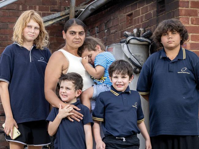 ADELAIDE, SOUTH AUSTRALIA - Advertiser Photos NOVEMBER 22, 2024: Telika and her family L to R Alexis 12yrs, Telika holding Ahmani 3yrs, Jacob 10yrs and in front Timmy 7yrs and Dylan 6yrs outside their fire damaged home. (Oldest son not pictured) Picture Emma Brasier