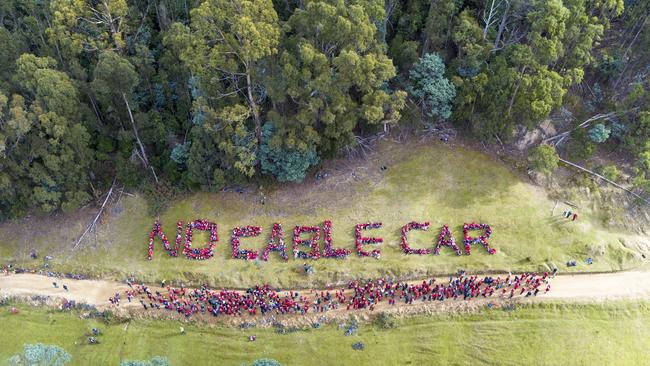 A human banner against the Mt Wellington cable car proposal. Picture: ROB BLAKERS