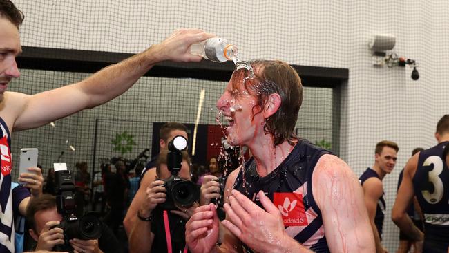 Mundy is drenched after playing his 300th game. Pic: AAP