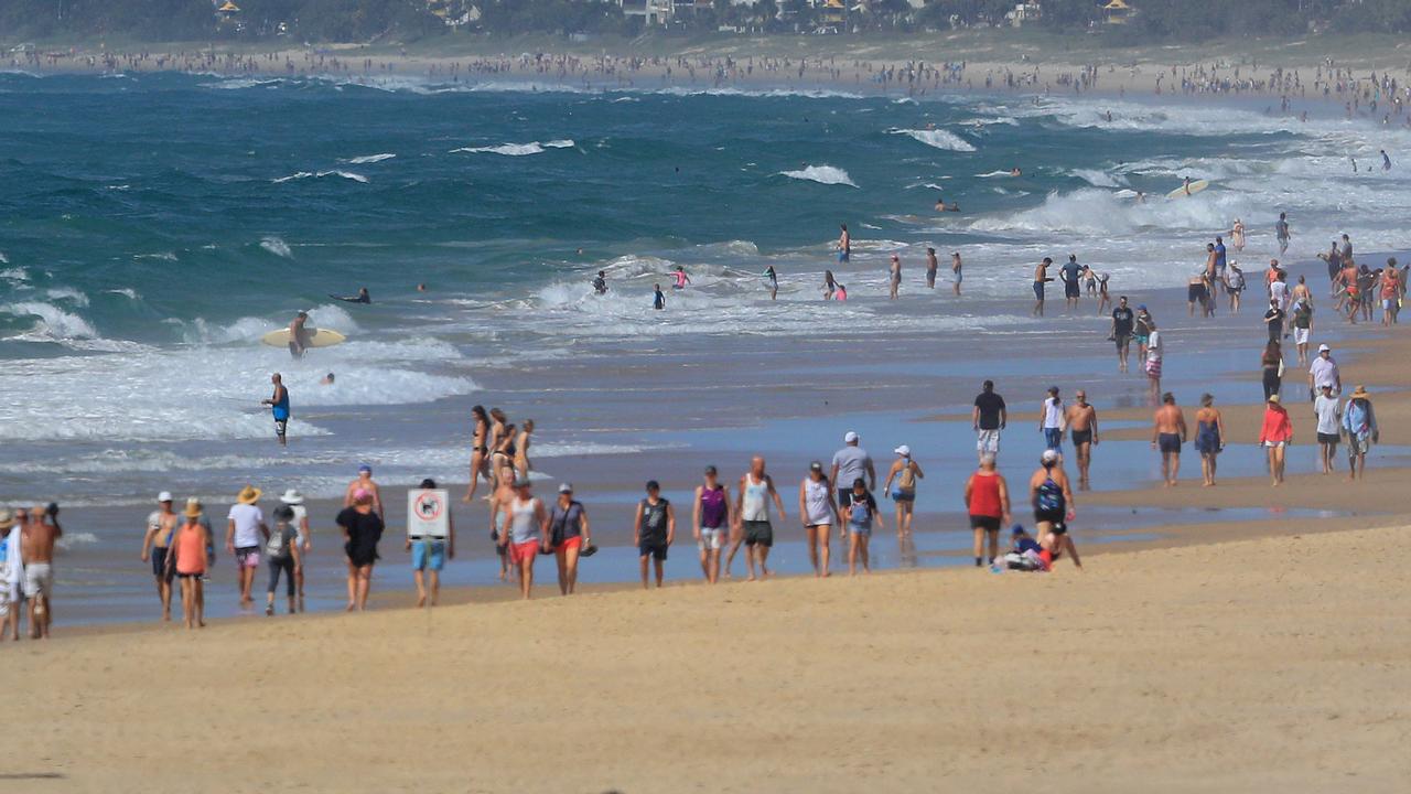 Lots of people still flocked to Main Beach and the Spit despite car parks being closed and the threat of Covid 19 (This pic takes from Narrowneck looking south). Pics Adam Head