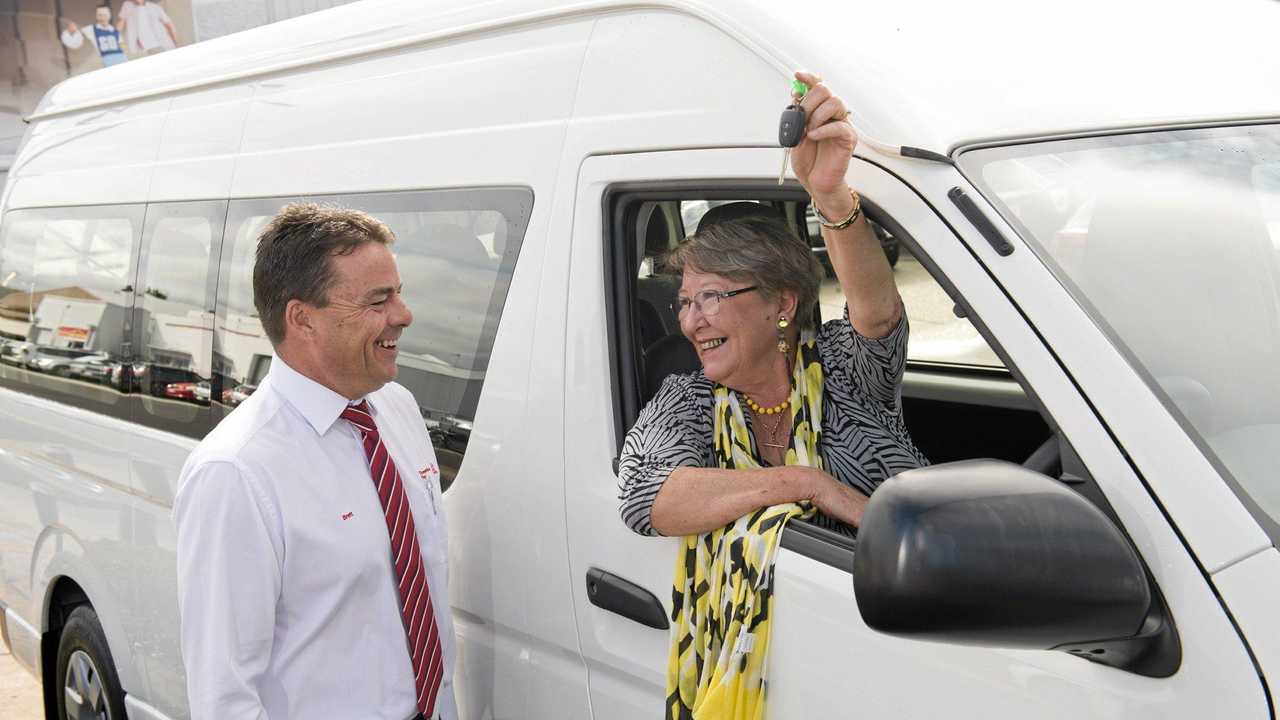 NEW PARTNERSHIP: Penny Hamilton is excited to be handed the keys to a new Toyota HiAce van from Brett Motton. Picture: Kevin Farmer