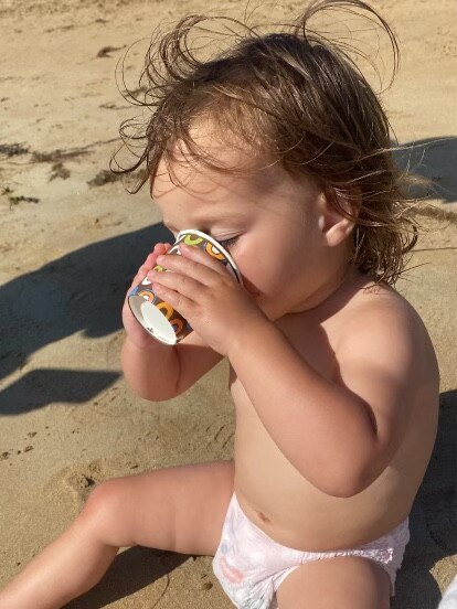 Flora Blu at Barwon Heads Beach having a babycino. Picture: Robert Cann, Craigieburn.