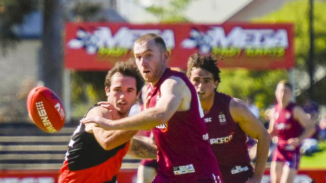 PAOC’s Cam Pritchard and Tea Tree Gully’s Brodie Latham. Picture: Roy VanDerVegt