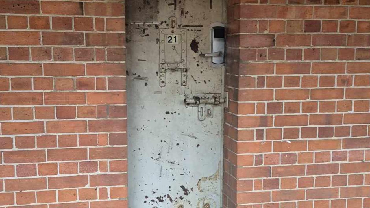 The door into one of the original prion cells, which is now used as a dorm room.