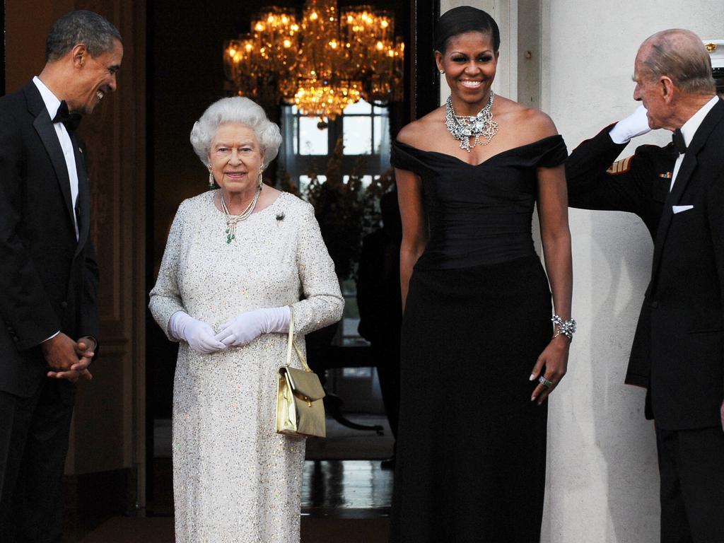 Michelle Obama copped criticism for wrapping her arm around Queen Elizabeth II in 2009. Picture: Jewel Samad/AFP