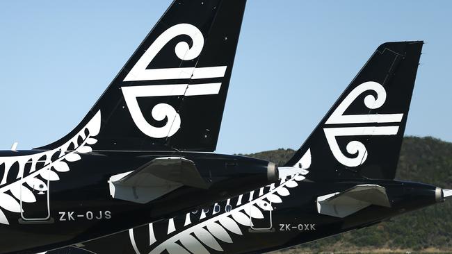 WELLINGTON, NEW ZEALAND - MARCH 16: The tails of Air New Zealand planes at Wellington Airport on March 16, 2020 in Wellington, New Zealand. Strict new border measures to contain the spread of COVID-19 came into effect at 1am on Monday, requiring all arrivals into New Zealand to self-isolate for 14 days upon arrival. Those in self-isolation must avoid social gatherings, work, school, child care facilities, university, religious gatherings, aged care and health facilities, prisons, sports gatherings, restaurants, and all public gatherings during the two-week period. New Zealand currently has eight confirmed cases of COVID-19. (Photo by Hagen Hopkins/Getty Images)