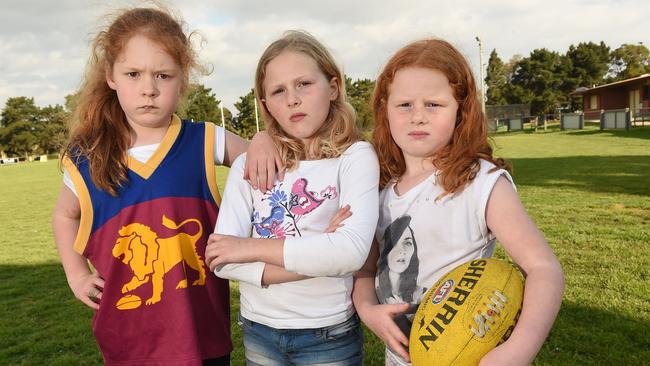 Keira, 8, Sienna, 8, and Scarlett, 6, are keen to play with a girls’ team at Carrum’s Roy Dore Reserve, but the clubhouse doesn’t even have a women’s changeroom. Picture: Chris Eastman