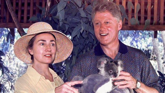 US President Bill Clinton cradles a tiny Koala in his arms as his wife Hillary looks on during their tour of Rainforest Habitat in Port Douglas during 1996 Australian tour 22/11/96. Clin/fam Tour/1996 animals koalas headshot tourism travel aust qld 1996 captivity