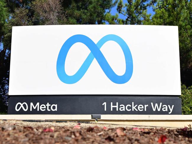 The Meta logo marks the entrance of Facebook corporate headquarters in Menlo Park, California on November 09, 2022. - Facebook owner Meta will lay off more than 11,000 of its staff in "the most difficult changes we've made in Meta's history," boss Mark Zuckerberg said on Wednesday. (Photo by JOSH EDELSON / AFP)