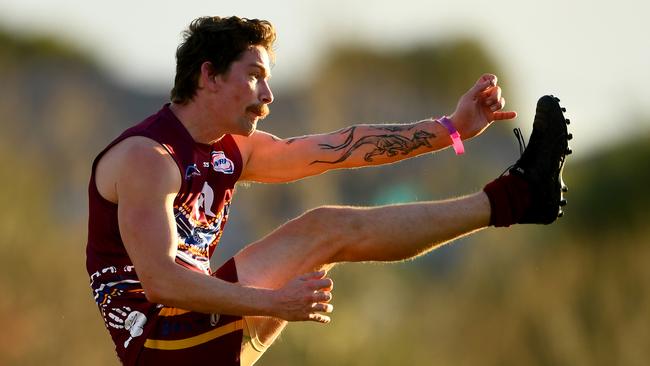 Joshua Stone of Tarneit kicks. (Photo by Josh Chadwick)