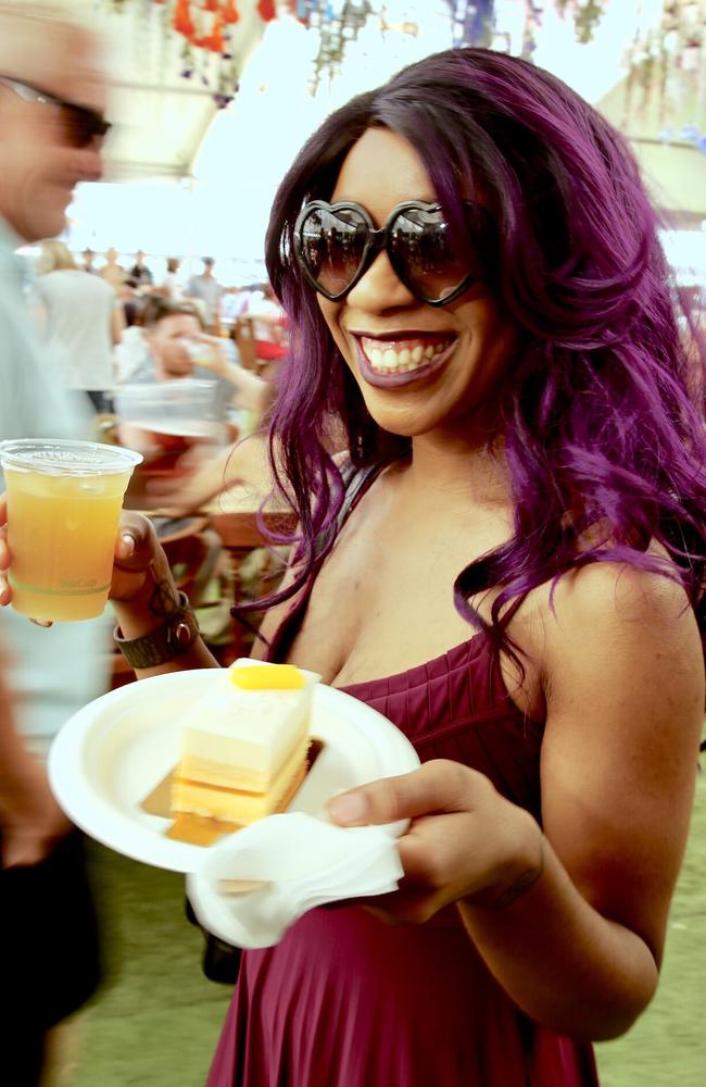 The Taste of Tasmania. Etienne Pinkston from LA with a coconut mango cake and Apple Peppermint tea from Macaroons by Ruby. Her partner is one of the Taste performers. Picture: EDDIE SAFARIK