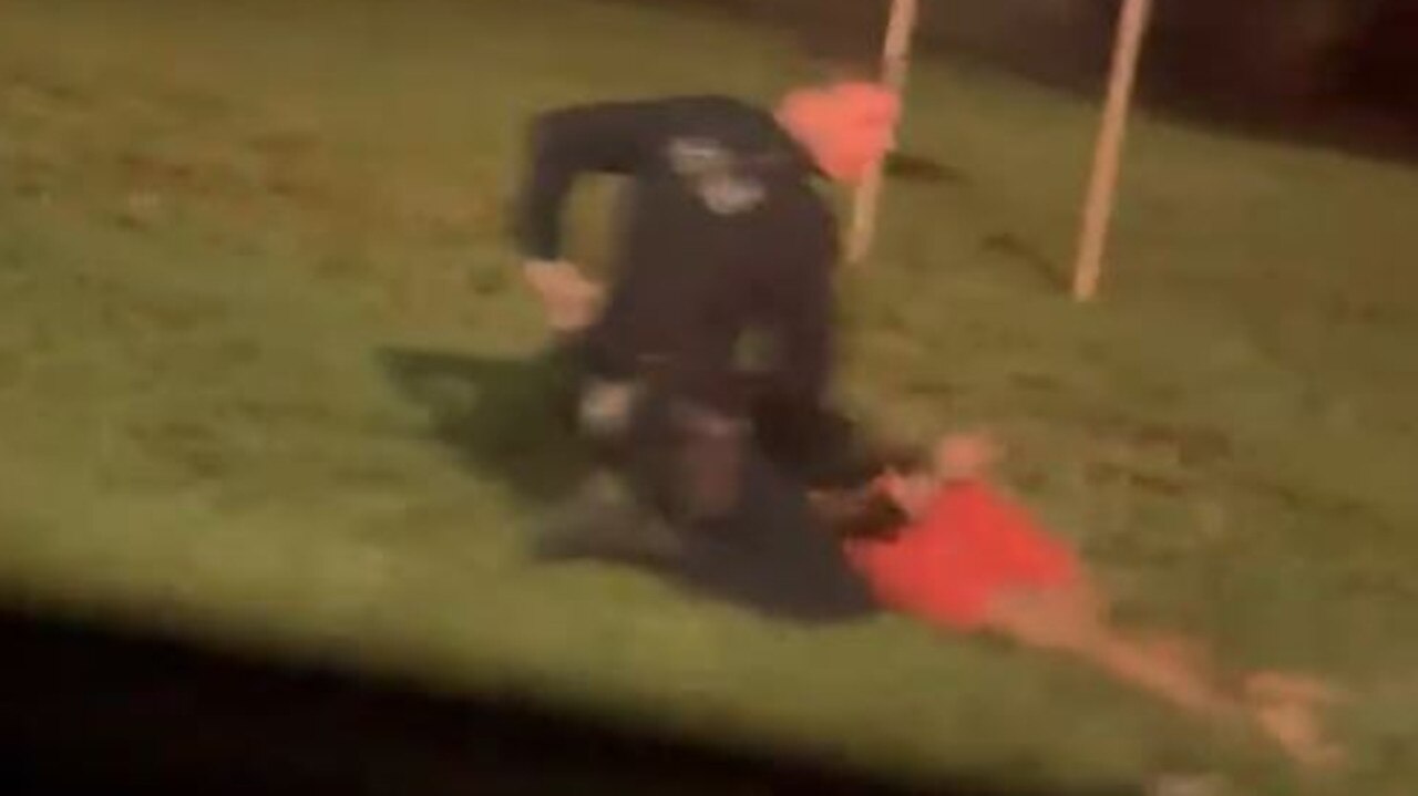 A police officer arresting one of the teenagers allegedly involved in the car chase. Picture: Supplied.