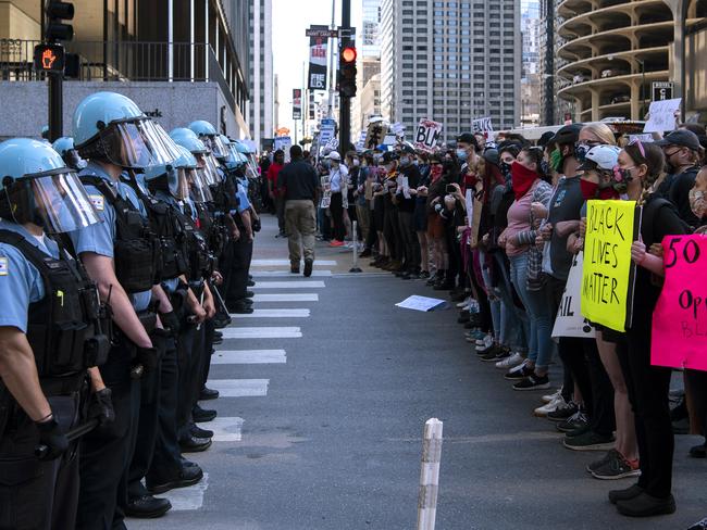 Protesters squad off with Chicago police on Kinzie and State Street in Chicago. Picture: Tyler LaRiviere