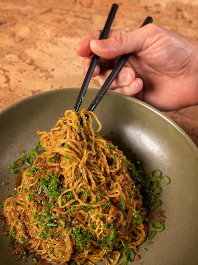 Wok tossed egg noodles with duck. Picture: Tony Gough