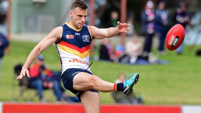 READY TO GO: Crow Brodie Smith kicks long in his SANFL comeback match against Central District. Picture: Tom Huntley.