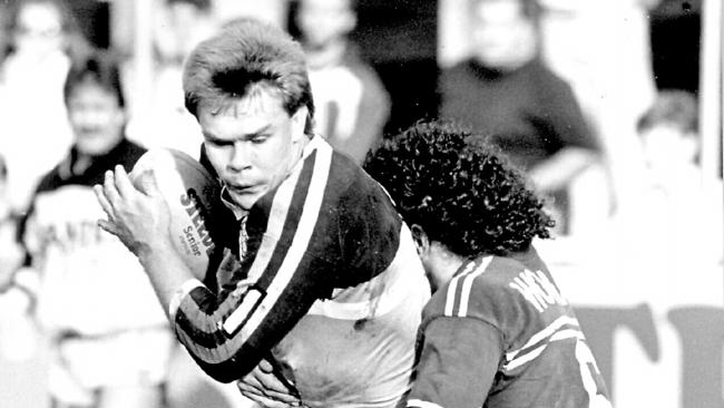 Troy McCarthy tackled by Cliff Lyons. Gold Coast v Manly. Pic Wayne Jones. 06/06/88.