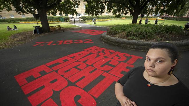 Artist Kartanya Maynard who collaborated with artist Vernon Ah Kee activate the space outside parliament with language and sound, palawa kani and calls of protest. Picture: Chris Kidd