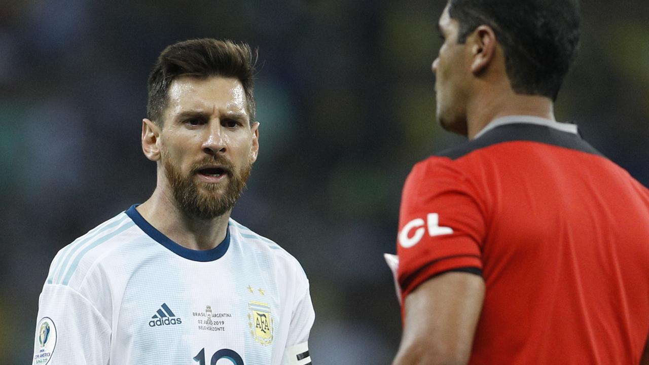 Argentina's Lionel Messi, left, complains to to referee Roddy Zambrano during the semi-final.