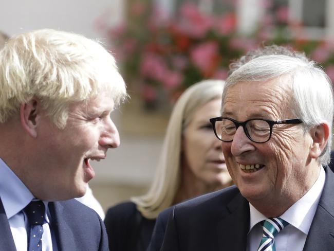 European Commission President Jean-Claude Juncker, centre, speaks with British Prime Minister Boris Johnson, left. Picture: AP