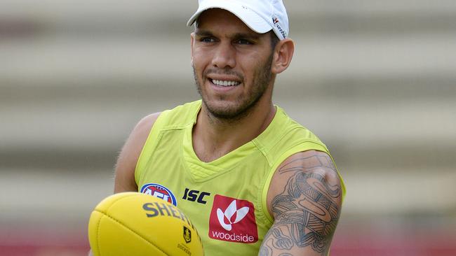 SPORT - The Fremantle Dockers train ahead of their season opener on Sunday. Photo by Daniel Wilkins. PICTURED- Harley Bennell walks the boundary during training