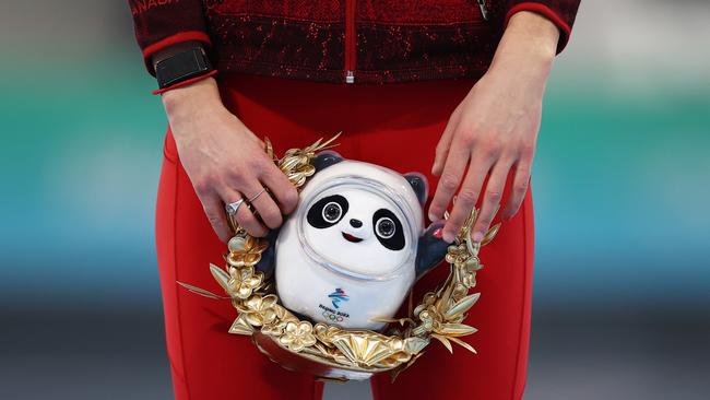 A detailed view as bronze medallist Isabelle Weidemann of Team Canada holds a Beijing 2022 Winter Olympic mascot Bing Dwen Dwen during the Women's 3000m flower ceremony. Picture: Getty Images)