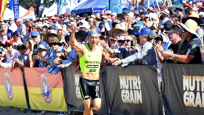 Huge crowds turned out to see the great Ali Day win his first Australian ironman crown at the event. It was the only big race Day has not won in surf life saving. Pic: HarvPix