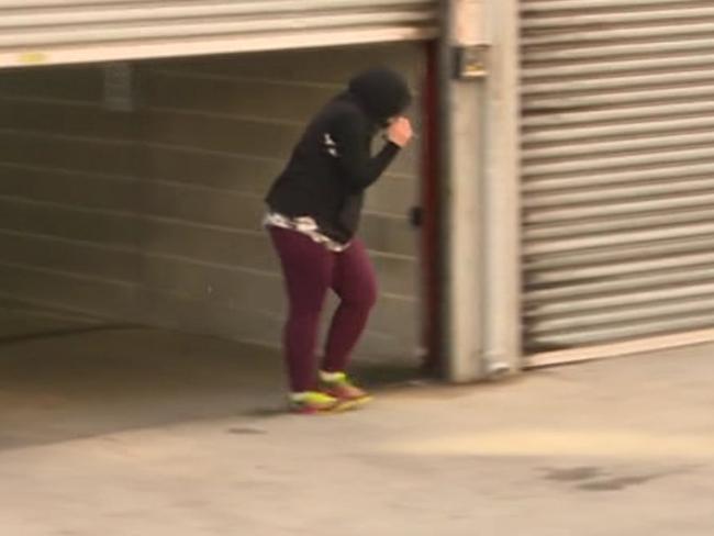 An unidentified woman, believed to be the driver, leaves Bankstown Police Station. Picture: Channel 7