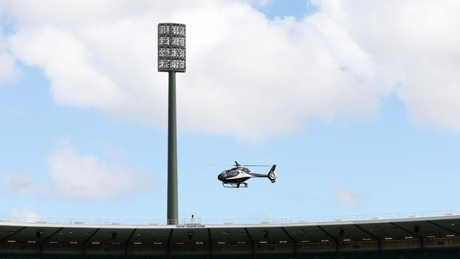 David Warner gets to SCG in a chopper.