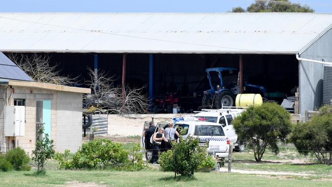 Police at the property during the search. Picture: Naomi Jellicoe