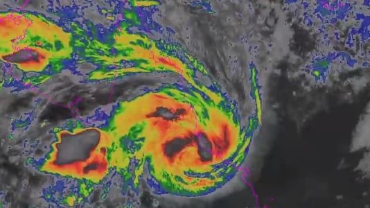Tropical cyclone crosses the north Queensland coast between Townsville and Ingham.