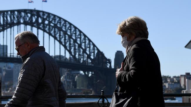 A woman is seen wearing a face mask as a preventive measure against COVID-19 in Sydney’s Circular Quay. Picture: Bianca De Marchi/NCA NewsWire