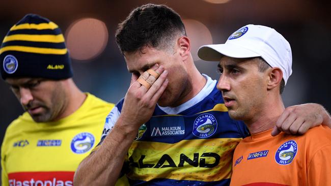 Mitchell Moses taken from the field in agony.