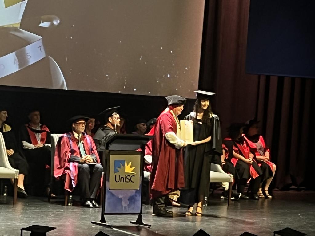 Graduates from the University of the Sunshine Coast's Fraser Coast campus celebrating at the Brolga Theatre.