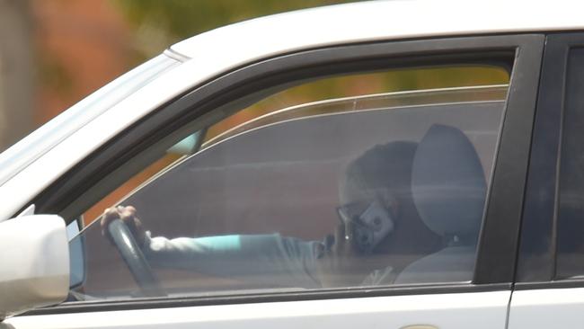 A woman talks with her phone in hand while driving on Dalrymple Rd. Picture: Evan Morgan