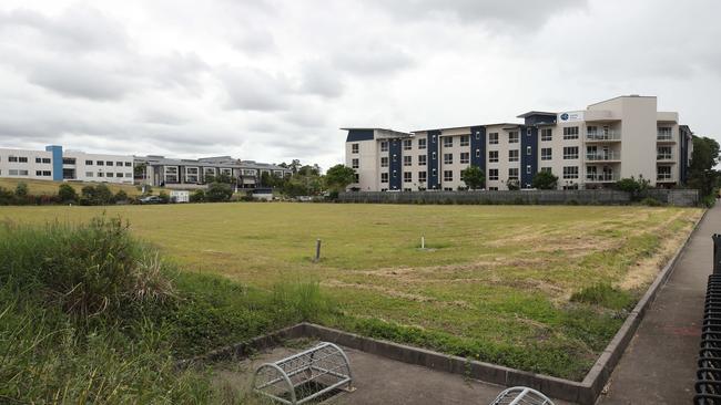 The empty site on Varsity Lakes' lake street which Bond University is planning to redevelop to build two high-rise towers for student accommodation. Picture: Glenn Hampson