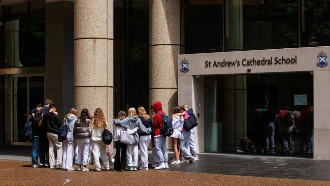 Pupils leave flowers at St Andrew's Cathedral School after the murder of Ms James. Picture: Justin Lloyd.