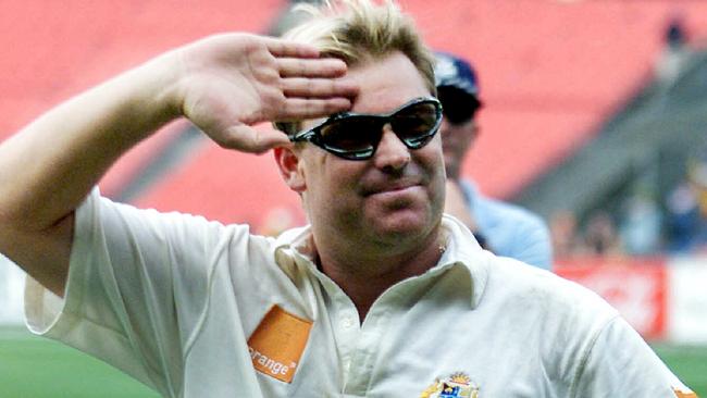 Shane Warne saluting crowd.