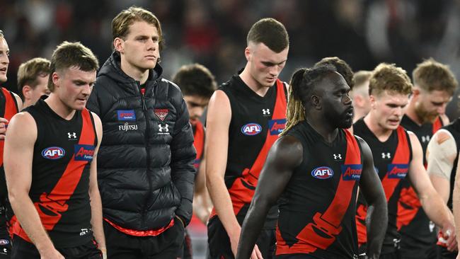 The Bombers walk off the field. Picture: Quinn Rooney/Getty Images