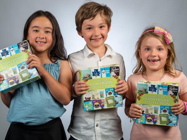 Ophia (7), Rory (7) and Sophia (5) with The Great Australian Storybook collection – available with News Corp newspapers. Picture: Jay Town