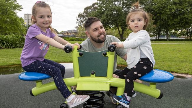 Kane McParland, who works for Sydney Trains and is in the $120,000-$180,000 tax bracket, with daughters Ayla, 4, and Navy, 16 months. Picture: Liam Mendes