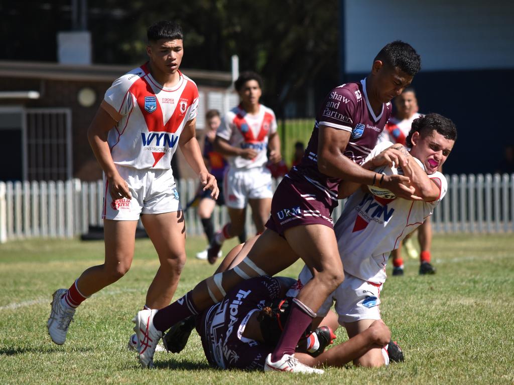 Carson Tmalii hits Zachariah Nachar in the Harold Matthews Cup. Picture: Sean Teuma/NewsLocal