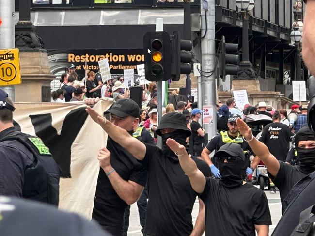 Masked men performed Nazi salutes in Melbourne’s CBD in March. Picture: Twitter