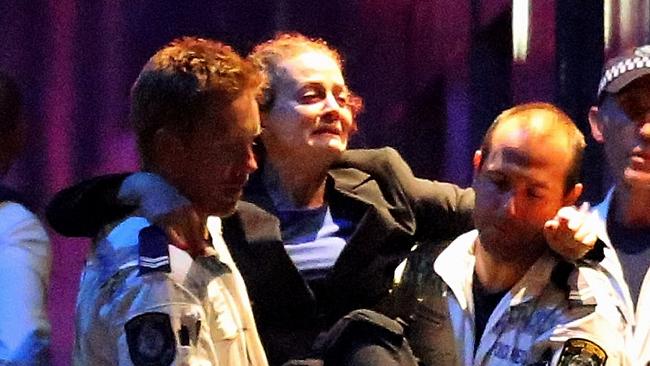 Marcia Mikhael is carried from the Lindt Cafe. Picture: Getty Images