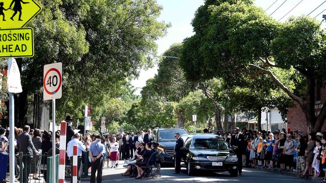 Mourners line the streets. Picture: Nicole Garmston