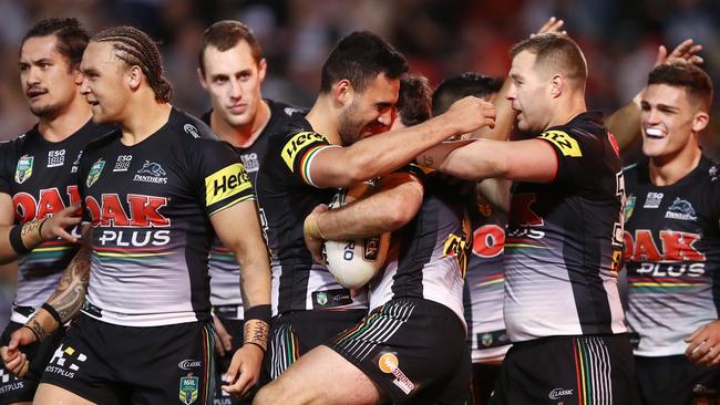 The Panthers congratulate James Maloney after he scored against the Raiders on Sunday night.